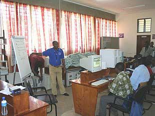 Mr. A. Ndosi, tatcot eLearning tutor gives advise to the students